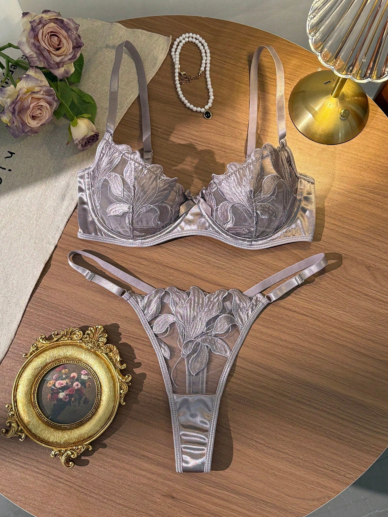 Women’s 2-piece sexy lingerie set featuring an embroidered sheer mesh demi bra with adjustable spaghetti straps and a matching low-rise thong.