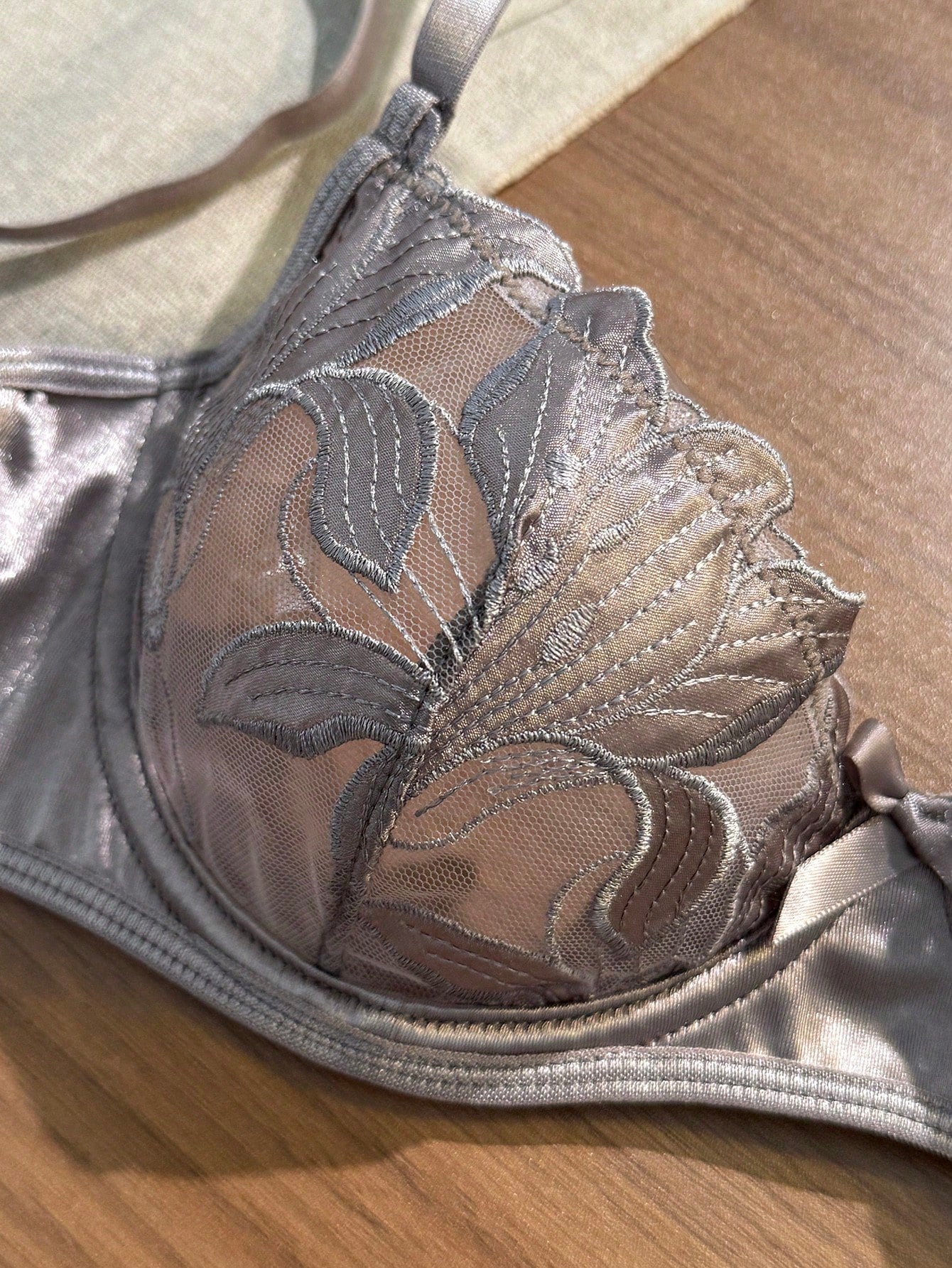 Women’s 2-piece sexy lingerie set featuring an embroidered sheer mesh demi bra with adjustable spaghetti straps and a matching low-rise thong.