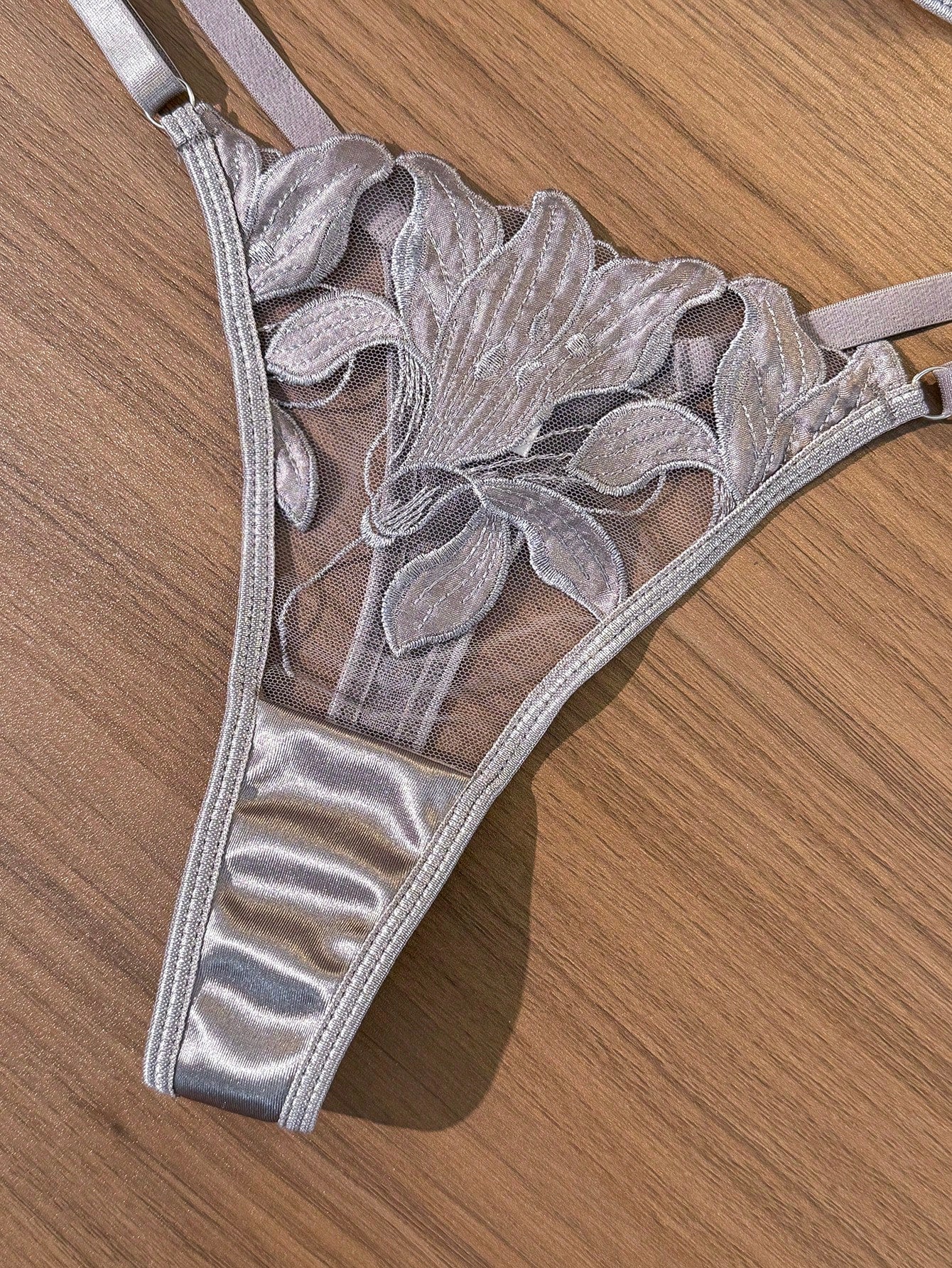 Women’s 2-piece sexy lingerie set featuring an embroidered sheer mesh demi bra with adjustable spaghetti straps and a matching low-rise thong.