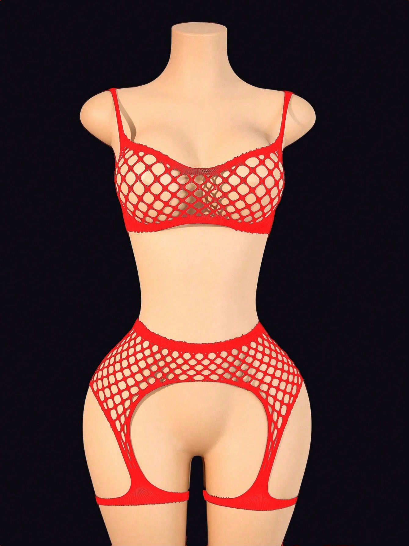 Black 2-piece fishnet lingerie set featuring a sheer wireless bralette with spaghetti straps and matching mini shorts with hollow-out detail; high-stretch fabric in a plain pattern.
