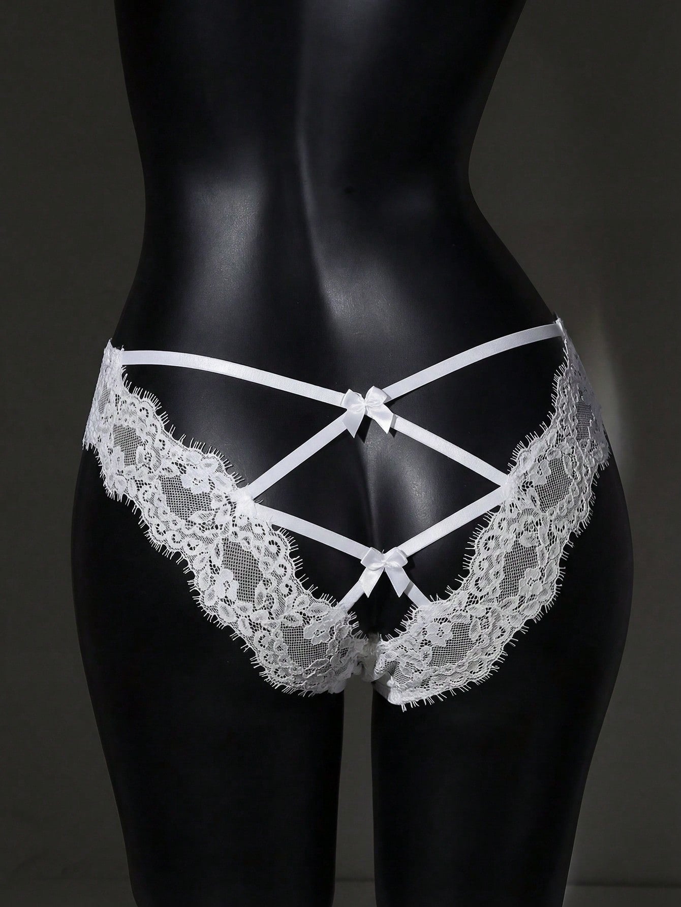 Women's low-rise lace briefs with bow detail, hollow-out patchwork, and Christmas pattern