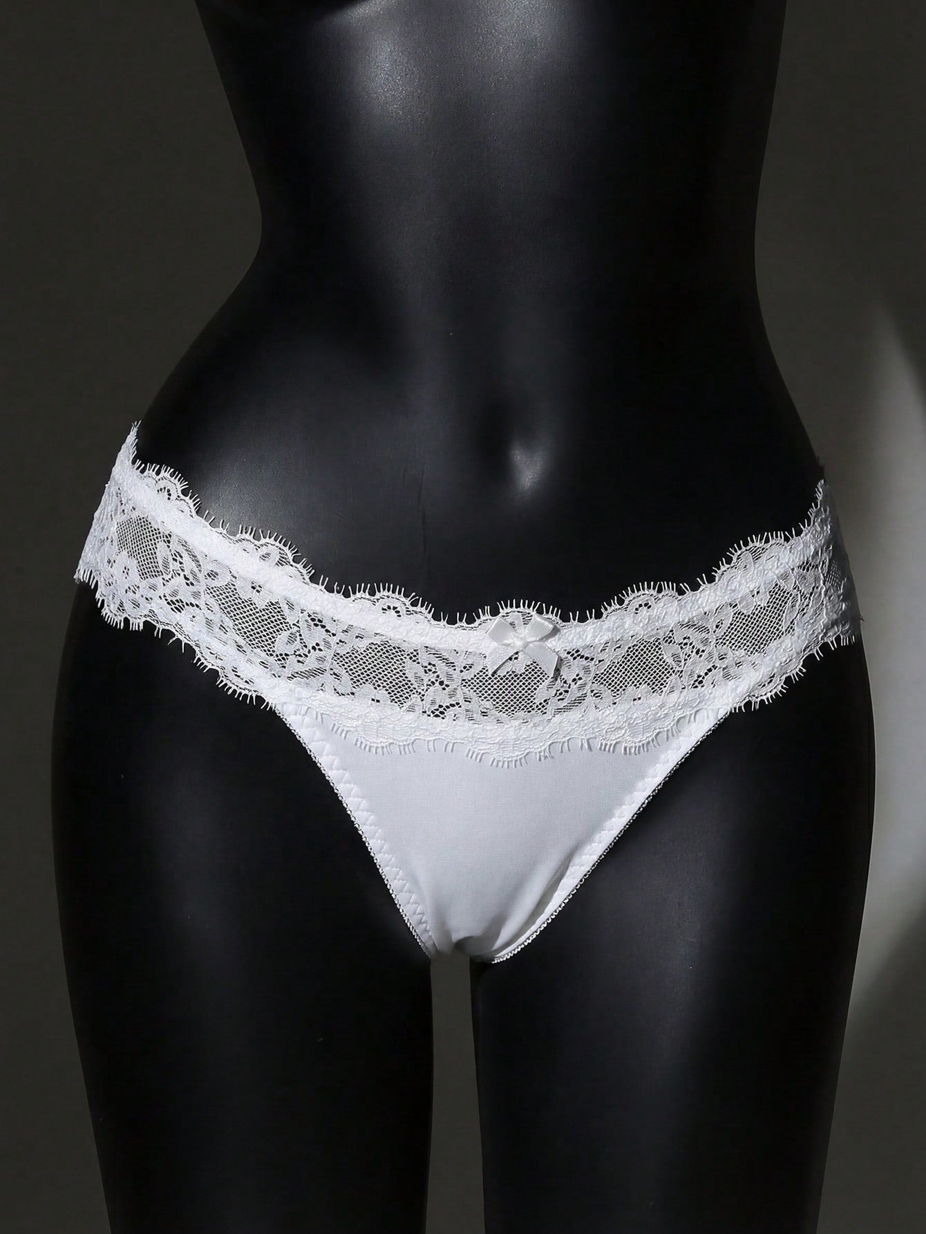 Women's low-rise lace briefs with bow detail, hollow-out patchwork, and Christmas pattern