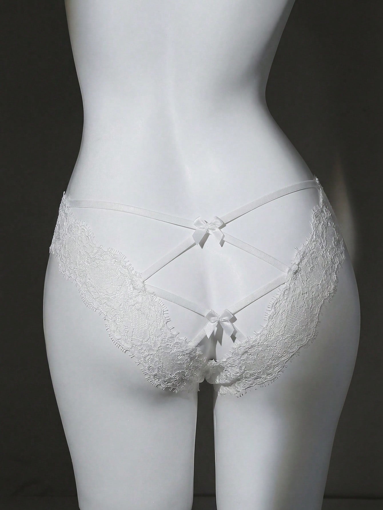 Women's low-rise lace briefs with bow detail, hollow-out patchwork, and Christmas pattern