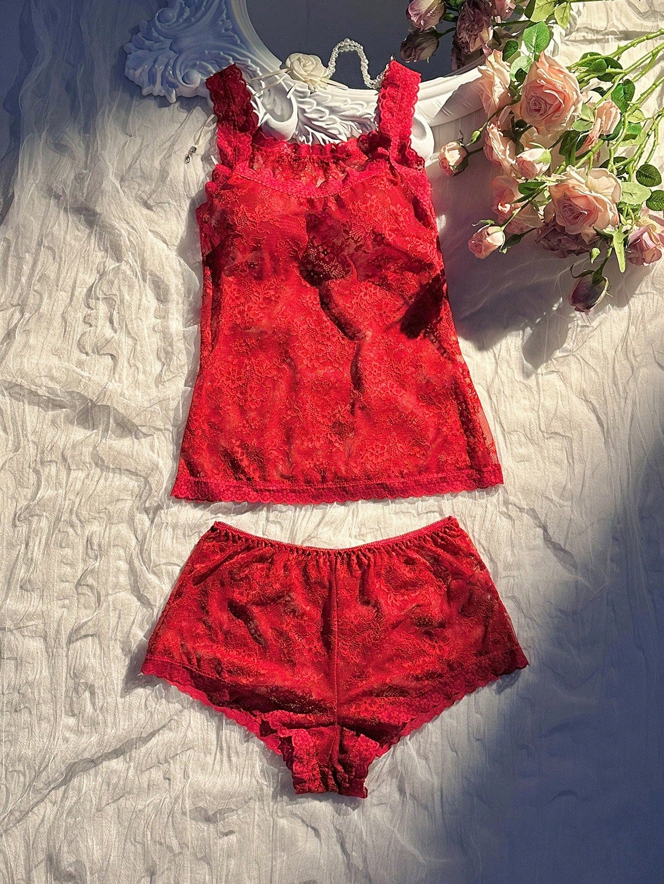 Women’s 2-piece sheer lace lingerie set featuring a camisole-style wireless bra with non-adjustable straps and matching low-rise boyshorts.