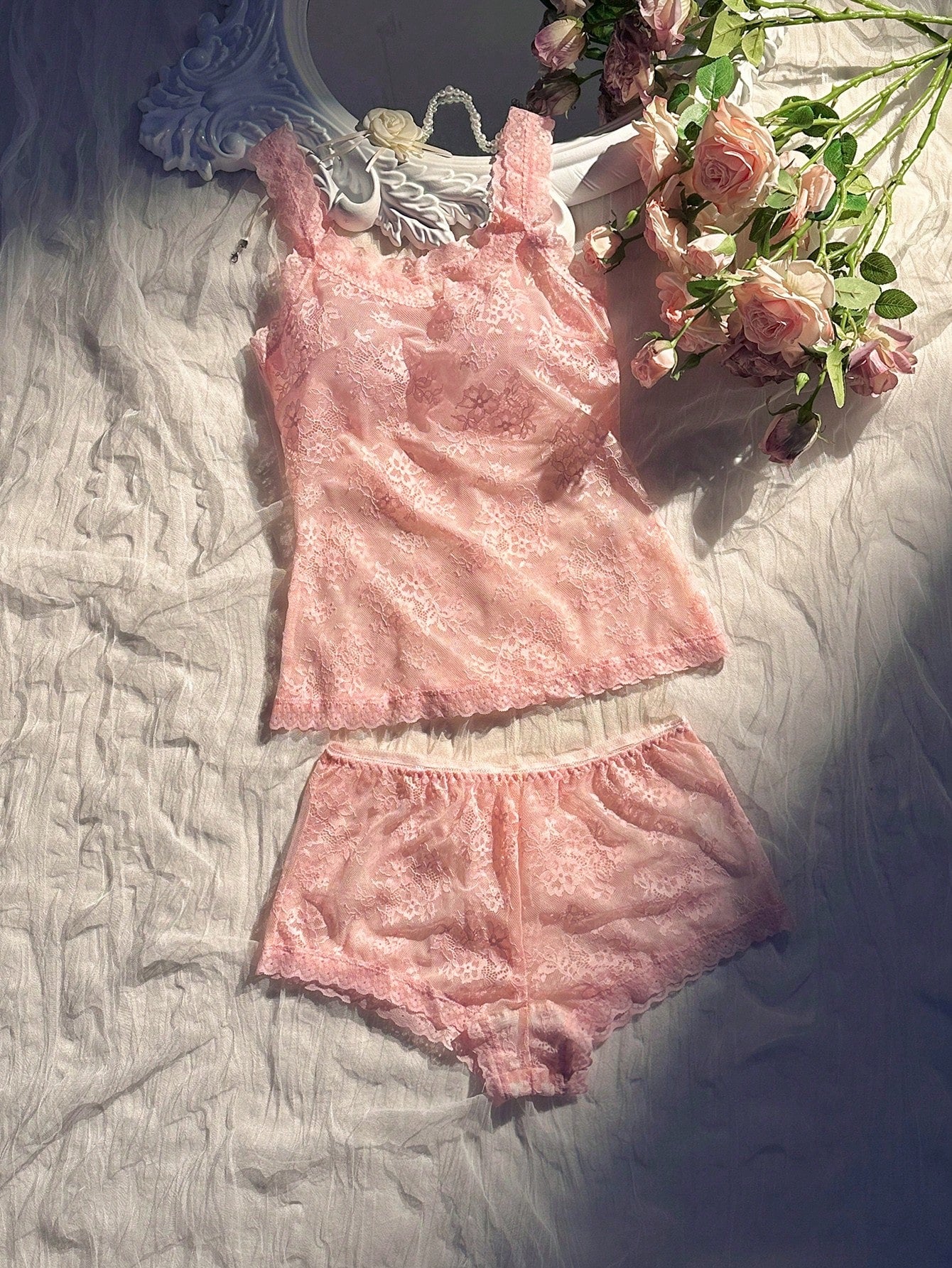 Women’s 2-piece sheer lace lingerie set featuring a camisole-style wireless bra with non-adjustable straps and matching low-rise boyshorts.