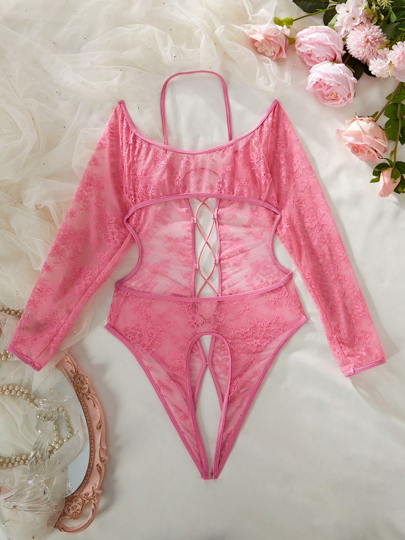 Elegant lace crotchless bodysuit with a backless lace-up design, adjustable spaghetti straps, and a V-string style bottom.