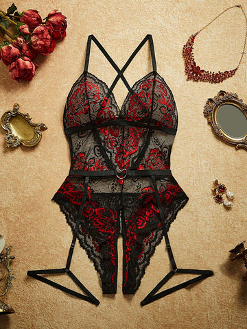 Two-piece women’s sexy lace bodysuit set with contrast lace, cut-out and sheer details, spaghetti straps, crossback design, sleeveless fit, and thong-style bottoms; wireless style for going-out or private party wear.