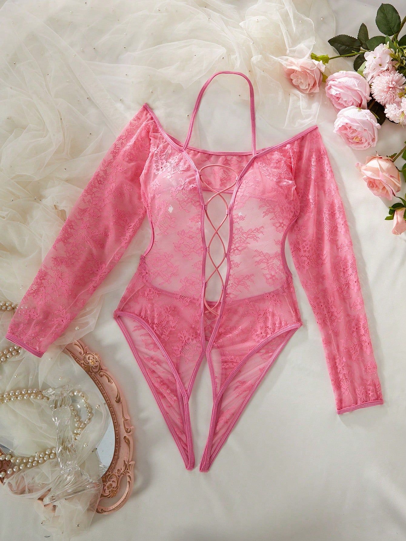 Elegant lace crotchless bodysuit with a backless lace-up design, adjustable spaghetti straps, and a V-string style bottom.