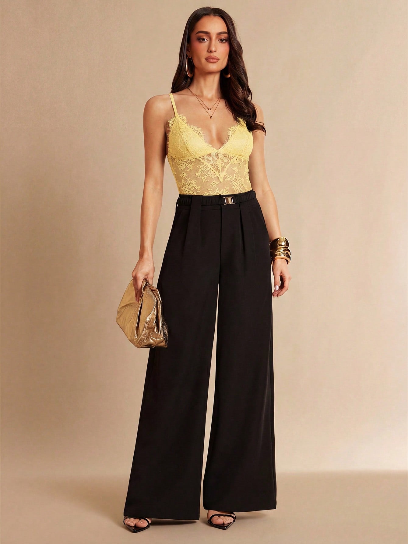Women's black bodysuit with lace trim, sheer details, backless design, and spaghetti straps in a slim-fit cami style.