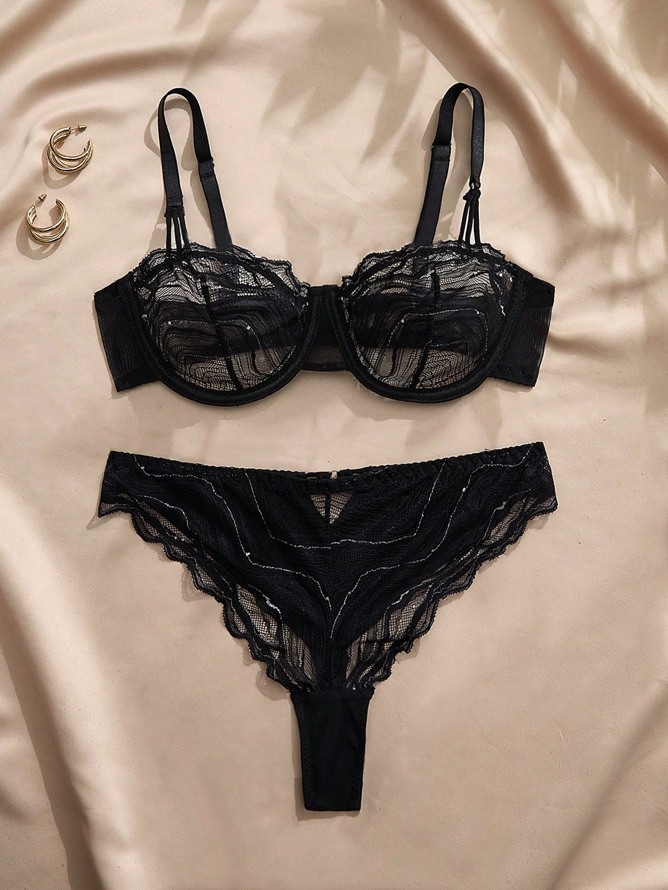 Black 2-piece lace lingerie set with an underwire bra, adjustable straps, and matching mid-rise briefs