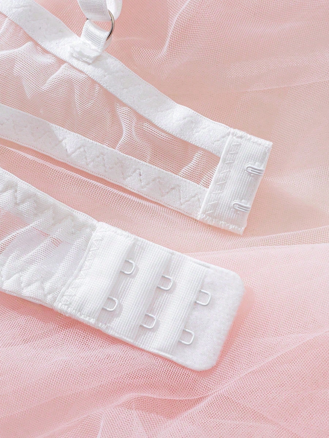 Light pink and white embroidered two-piece lingerie set with underwire 1/2 cup bra and matching panty