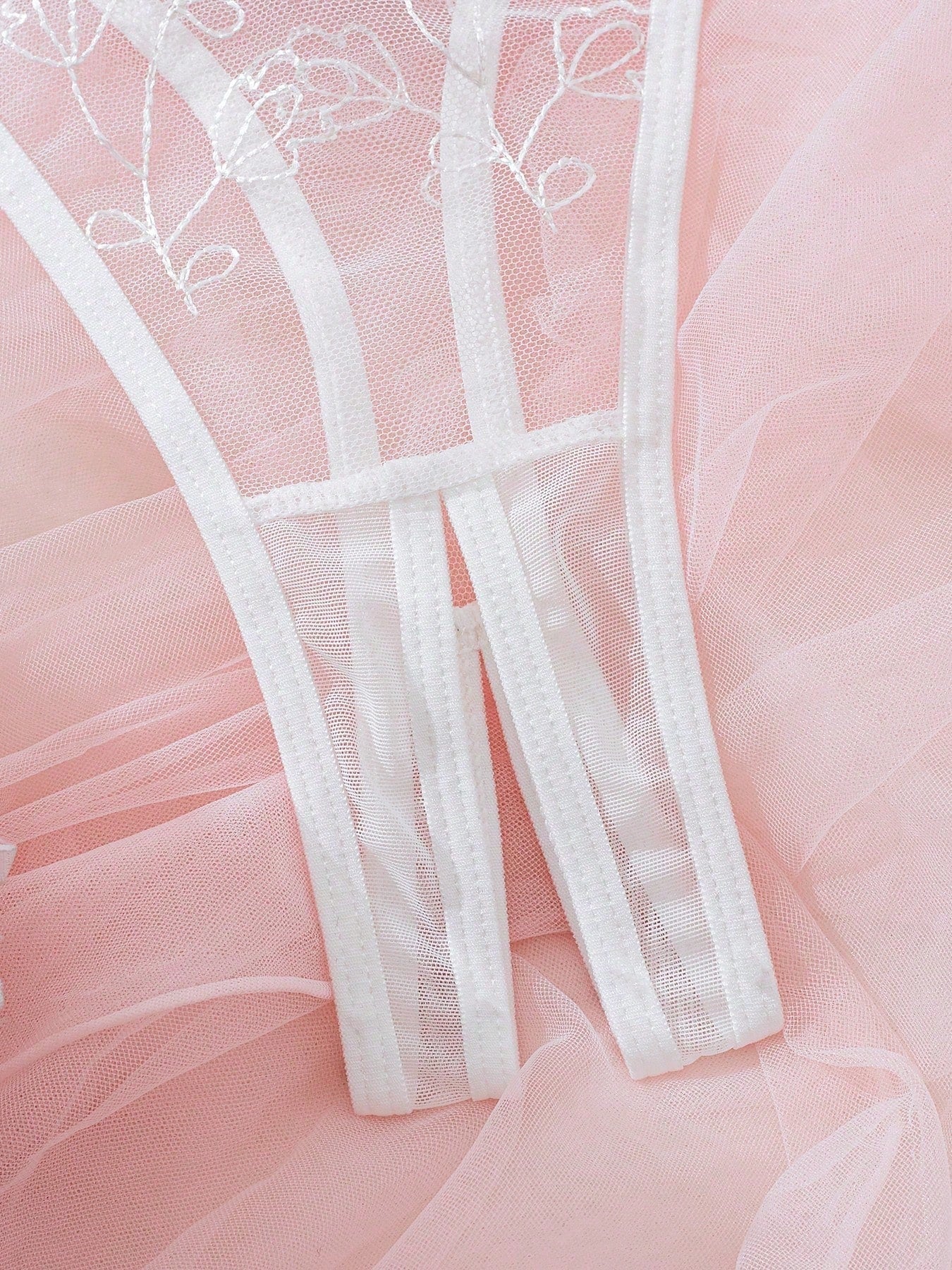 Light pink and white embroidered two-piece lingerie set with underwire 1/2 cup bra and matching panty