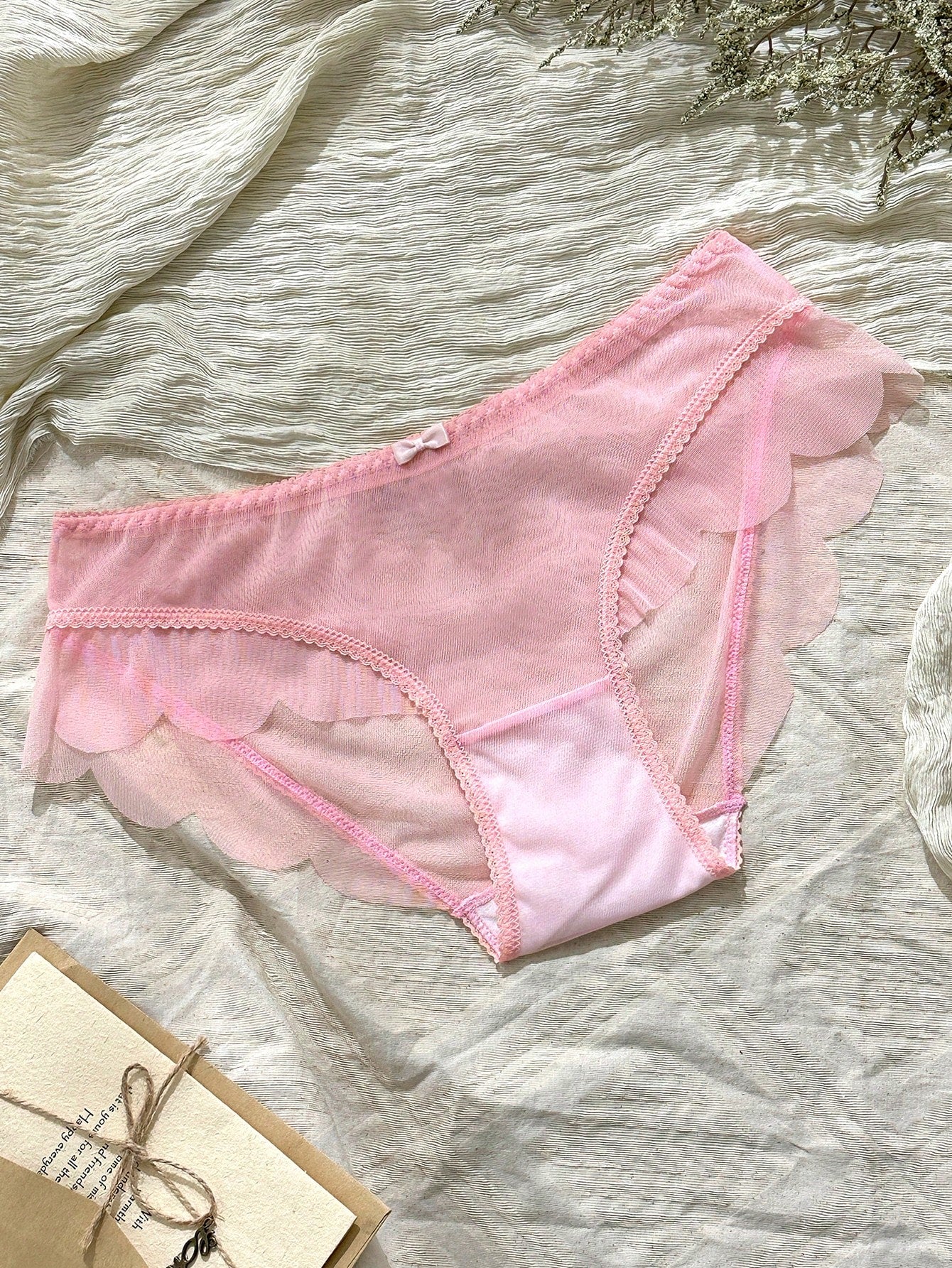 Baby pink women's mid rise brief panties with bow decor, sheer details, and a plain cute-sweet design