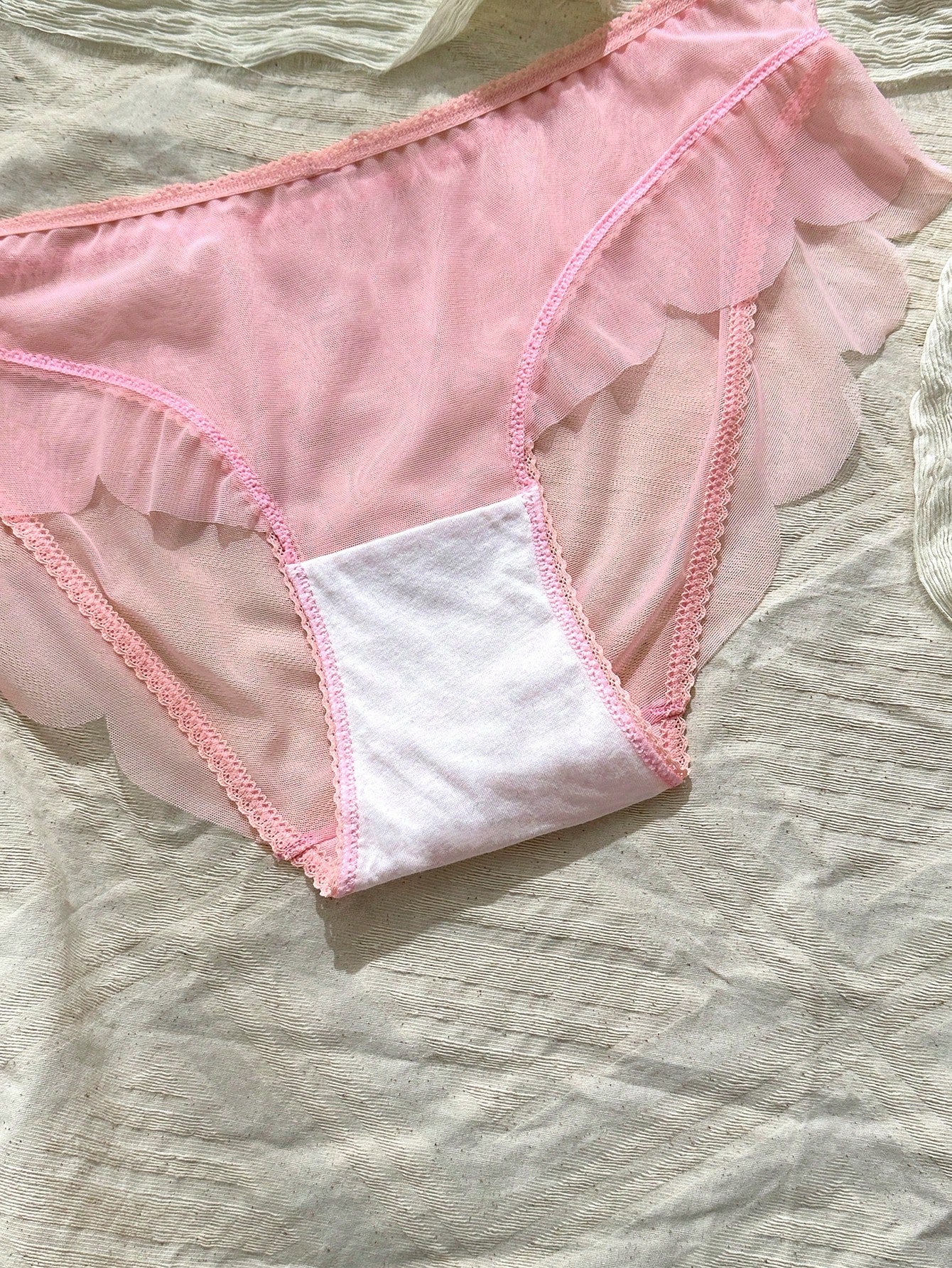 Baby pink women's mid rise brief panties with bow decor, sheer details, and a plain cute-sweet design