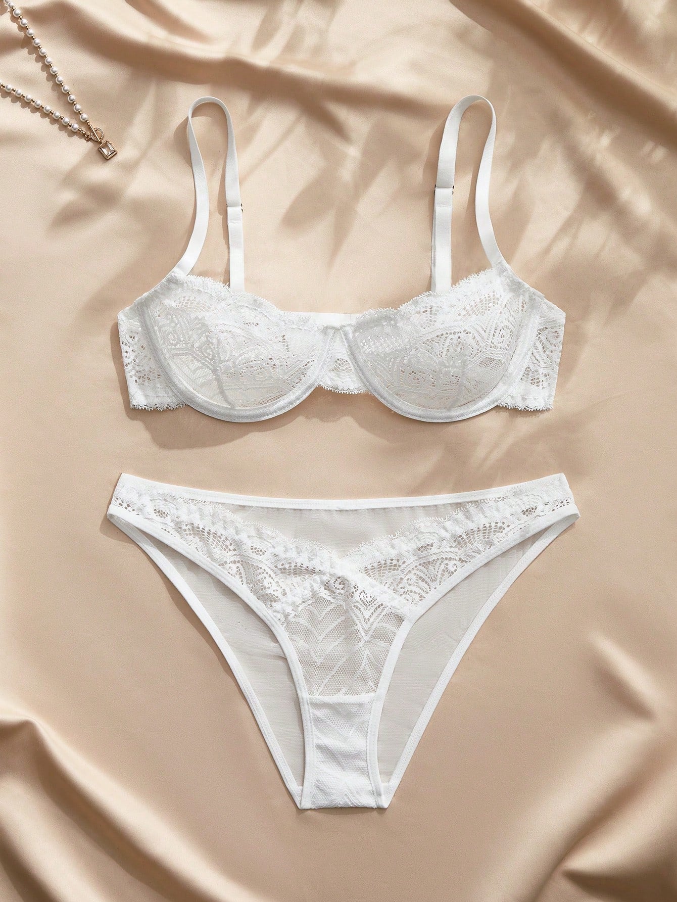 White 2-piece romantic floral lace lingerie set with 3/4 cup push-up underwire bra, adjustable straps, backless detail, and matching mid-rise briefs