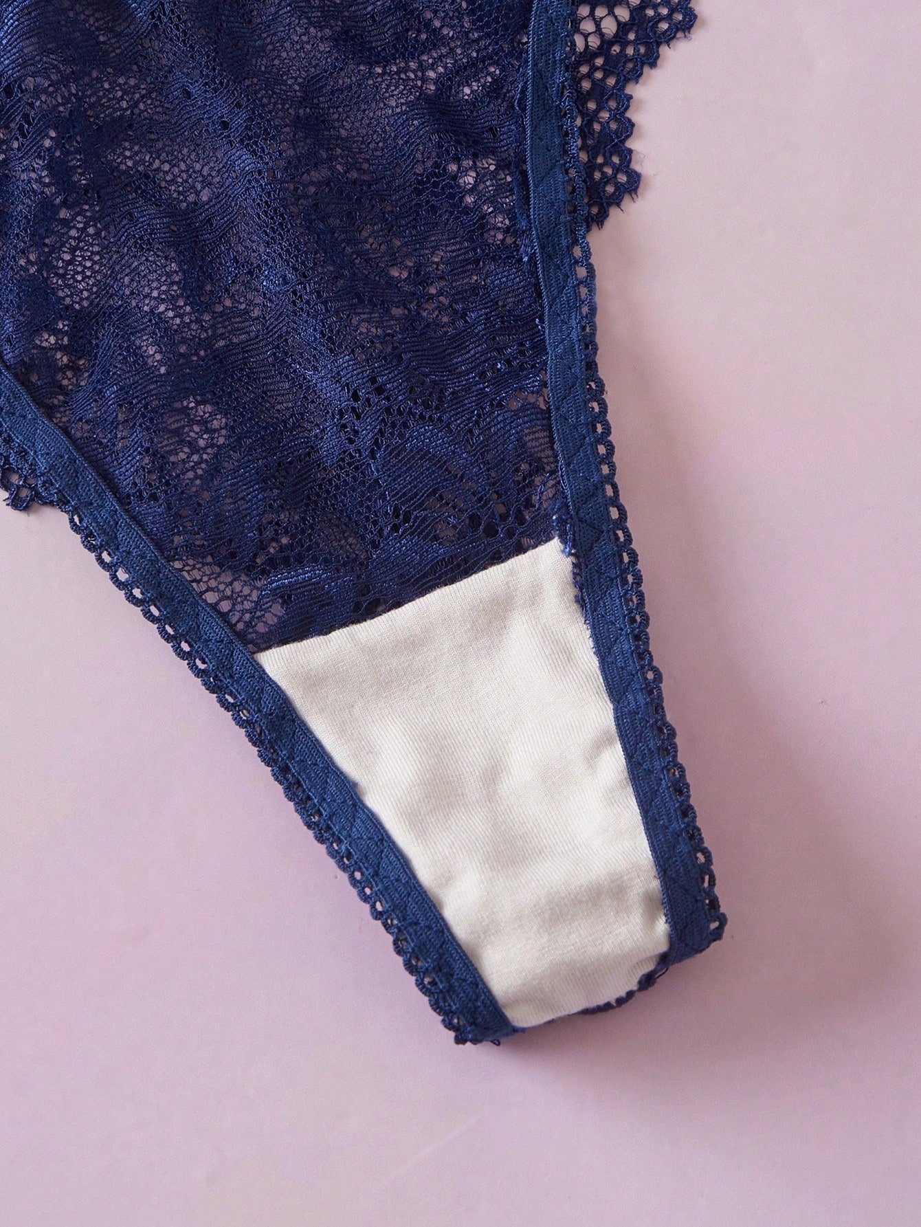 Navy blue floral lace 2-piece lingerie set with wireless triangle bra, adjustable spaghetti straps, sheer lace details, and matching mid-rise thong.