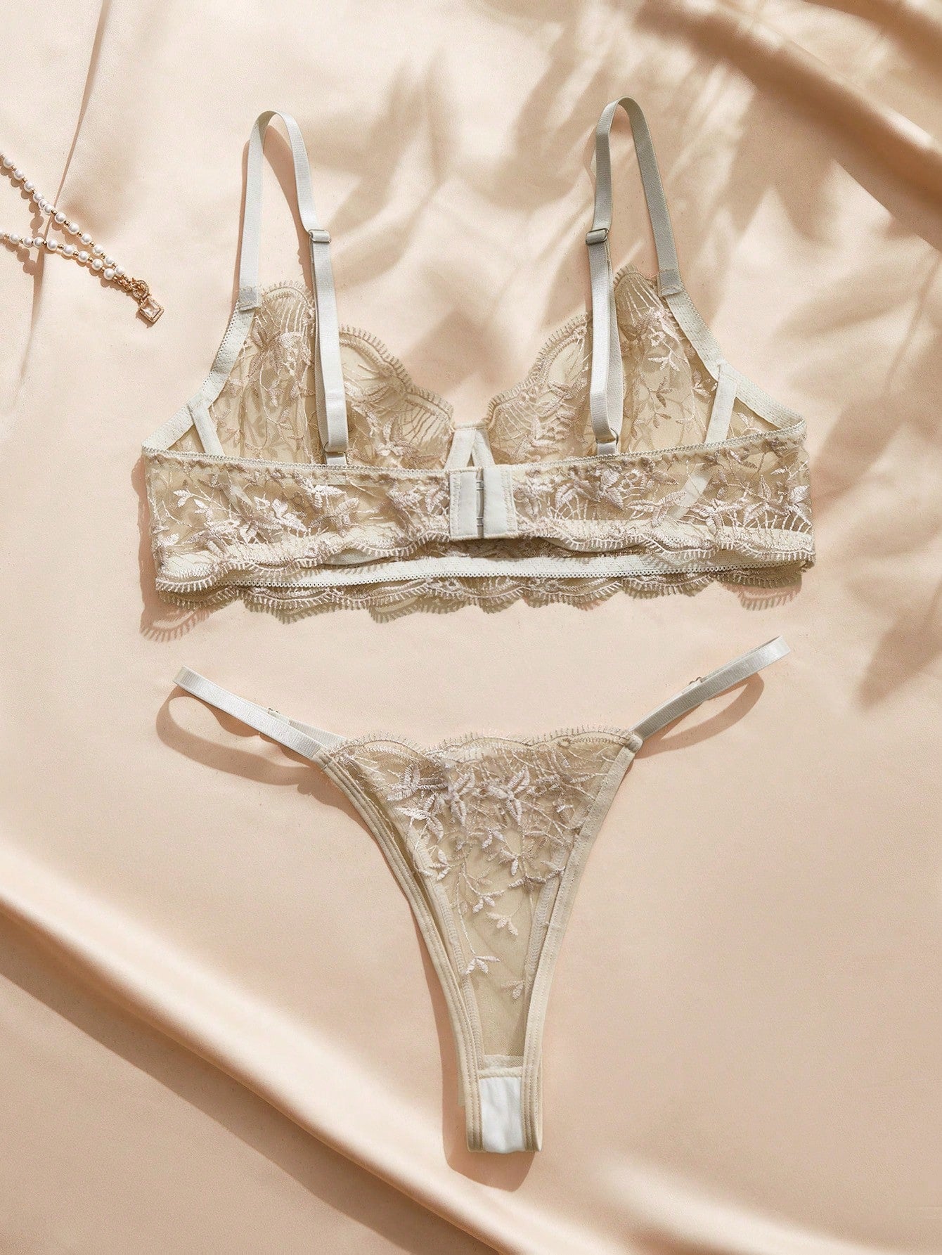 Embroidered sheer mesh demi bra and low-rise thong lingerie set with plant pattern and adjustable spaghetti straps
