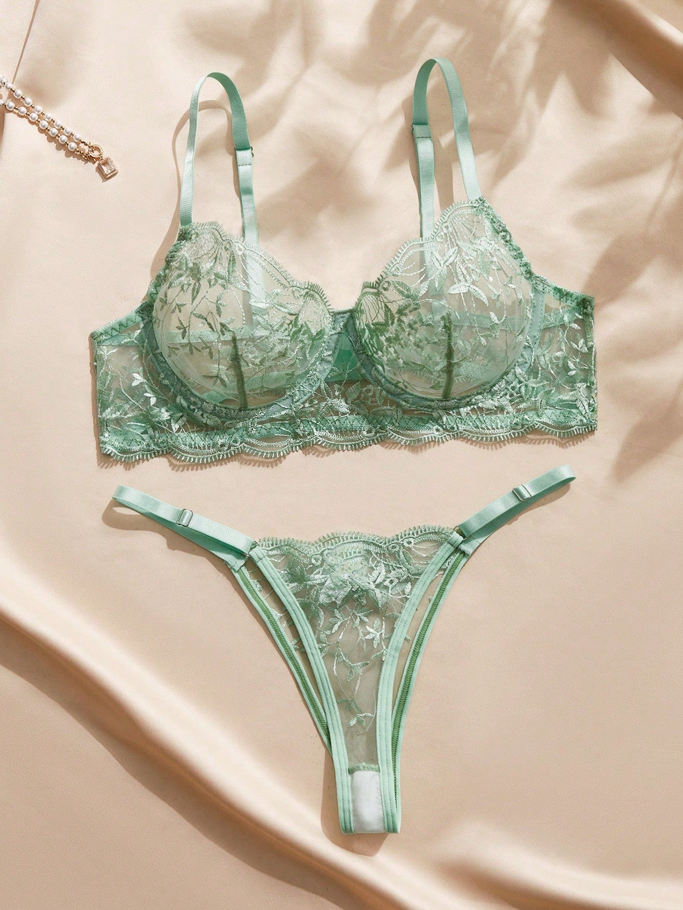 Embroidered sheer mesh demi bra and low-rise thong lingerie set with plant pattern and adjustable spaghetti straps