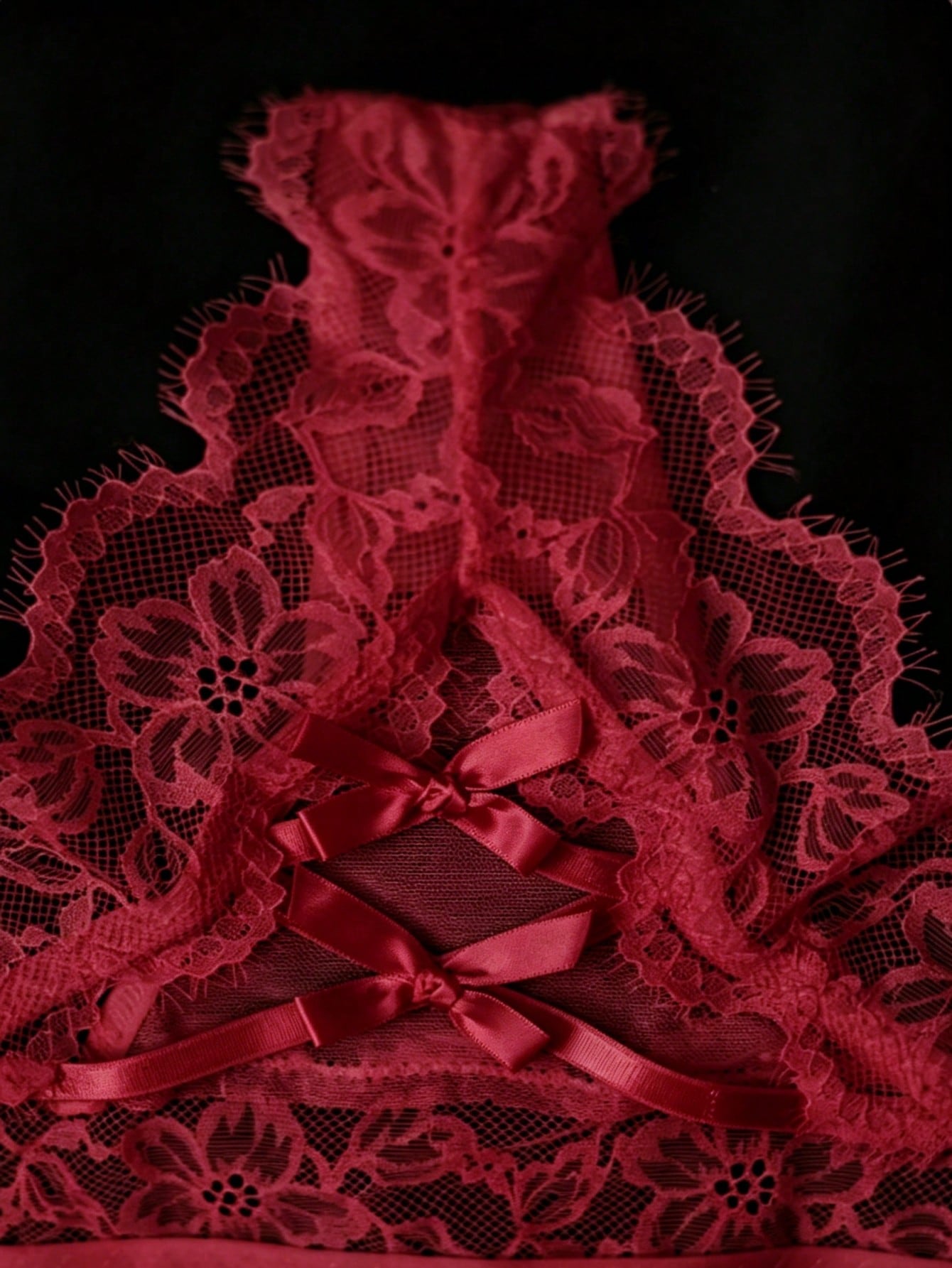 Women's low-rise lace mesh trim thong panties with sheer detailing, bow and knot accents, and plant pattern